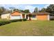 Charming single-story home with a well-maintained lawn and landscaping at 453 Weathersfield Ave, Altamonte Springs, FL 32714