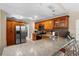 Well-equipped kitchen featuring granite countertops, stainless steel appliances, and wood cabinets at 453 Weathersfield Ave, Altamonte Springs, FL 32714