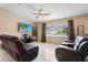 Spacious living room with tile floors, a ceiling fan, and a large window at 453 Weathersfield Ave, Altamonte Springs, FL 32714