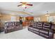 Open living area with comfortable seating, connecting to the kitchen and dining space at 453 Weathersfield Ave, Altamonte Springs, FL 32714