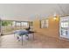 The enclosed patio offers a versatile space for dining, entertaining, or relaxation with a ping pong table at 453 Weathersfield Ave, Altamonte Springs, FL 32714