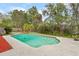 The pool in the backyard is surrounded by lush landscaping, creating a private oasis for relaxation and recreation at 453 Weathersfield Ave, Altamonte Springs, FL 32714