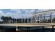The photograph captures a sign for Altamonte Springs under a bright, sunny sky at 453 Weathersfield Ave, Altamonte Springs, FL 32714