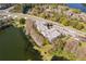Condos located near a lake and roadways with nearby neighborhoods and foliage at 4575 S Texas Ave # 205, Orlando, FL 32839