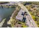 Aerial view of lake-side condos, adjacent roadways, and a lush environment at 4575 S Texas Ave # 205, Orlando, FL 32839