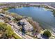 Overhead view of apartments near a picturesque lake, highlighting the building and its tranquil setting at 4575 S Texas Ave # 205, Orlando, FL 32839