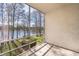 Relaxing screened balcony with serene lake views, offering a peaceful outdoor retreat at 4575 S Texas Ave # 205, Orlando, FL 32839