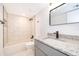 Updated bathroom featuring sleek fixtures, granite vanity and a tiled shower/bath at 4575 S Texas Ave # 205, Orlando, FL 32839
