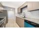Modern kitchen features granite countertops, stainless steel appliances, and white subway tile backsplash at 4575 S Texas Ave # 205, Orlando, FL 32839