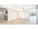 Bright living room open to kitchen, features new floors and access to a screened balcony with lake views at 4575 S Texas Ave # 205, Orlando, FL 32839