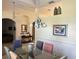 Elegant dining room with a glass table, chandelier, and stylish decor at 4847 Lake Milly Dr, Orlando, FL 32839