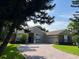 Charming single-story home features a brick driveway, attached garage, and well-maintained landscaping at 4847 Lake Milly Dr, Orlando, FL 32839