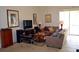Comfortable living room with tile floors, contemporary furnishings, and lots of natural light from a sliding door at 4847 Lake Milly Dr, Orlando, FL 32839
