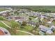 An aerial shot highlights the property's position in a well-established neighborhood at 5071 Heatherstone Dr, Kissimmee, FL 34758