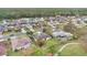 This aerial view shows the property's location within a peaceful residential area near a lake at 5071 Heatherstone Dr, Kissimmee, FL 34758