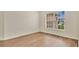 Serene bedroom with wood floors and a window that fills the room with natural light and brightens the space at 5071 Heatherstone Dr, Kissimmee, FL 34758