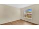 Neutral bedroom with wood-look floors and view of exterior at 5071 Heatherstone Dr, Kissimmee, FL 34758