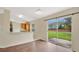 The kitchen features a breakfast bar and sliding glass doors opening to the backyard at 5071 Heatherstone Dr, Kissimmee, FL 34758