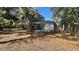 Spacious backyard with a screened pool, offering plenty of room for outdoor activities and relaxation at 5200 Brosche Rd, Orlando, FL 32807