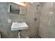 Bathroom featuring tiled walls, a shower and a modern wall mount sink at 5200 Brosche Rd, Orlando, FL 32807