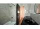 Full bathroom featuring modern black vanity and a bathtub with shower at 5200 Brosche Rd, Orlando, FL 32807