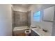 Modern bathroom featuring tiled shower, new fixtures, vanity and mirror at 5200 Brosche Rd, Orlando, FL 32807