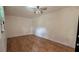 This is a bedroom with brown-tiled floors and a ceiling fan at 5200 Brosche Rd, Orlando, FL 32807