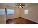 Bedroom with a ceiling fan and windows bringing in natural light at 5200 Brosche Rd, Orlando, FL 32807