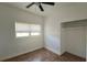 Bedroom with a large window, ceiling fan and closet at 5200 Brosche Rd, Orlando, FL 32807