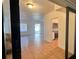 Inviting entryway offering views of the living area and updated kitchen at 5200 Brosche Rd, Orlando, FL 32807