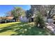 Lovely single-story home boasts a well-maintained lawn and mature landscaping, enhancing its welcoming curb appeal at 5200 Brosche Rd, Orlando, FL 32807