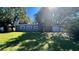 Charming single-story home featuring a lush green lawn and mature trees, offering a serene and inviting curb appeal at 5200 Brosche Rd, Orlando, FL 32807