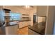 Efficient kitchen layout with granite countertops and white cabinets at 5200 Brosche Rd, Orlando, FL 32807