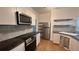 Modern kitchen with sleek appliances, granite counters, and updated cabinetry at 5200 Brosche Rd, Orlando, FL 32807