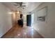 Open-concept living space featuring tiled floors, a ceiling fan, and a view into the adjoining bathroom and kitchen at 5200 Brosche Rd, Orlando, FL 32807