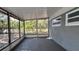 Enclosed patio area provides a versatile space for relaxation or entertainment, shielded from the elements at 5200 Brosche Rd, Orlando, FL 32807
