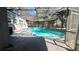 Outdoor space featuring a screened-in pool, ideal for entertaining and enjoying the Florida sunshine at 5200 Brosche Rd, Orlando, FL 32807