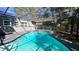 Refreshing in-ground pool with a screened enclosure, perfect for enjoying a swim while enjoying the sun at 5200 Brosche Rd, Orlando, FL 32807