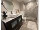 Charming bathroom with vessel sink, stylish vanity, and a frameless glass shower with elegant tile at 5337 Indian Creek Dr # C-4-1, Orlando, FL 32811