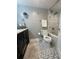 Stylish bathroom featuring a sleek vanity and tiled shower at 5337 Indian Creek Dr # C-4-1, Orlando, FL 32811