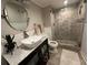 Charming bathroom with vessel sink, stylish vanity, and a frameless glass shower with elegant tile at 5337 Indian Creek Dr # C-4-1, Orlando, FL 32811