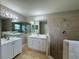 Bathroom featuring a shower, tub, double vanity with sink, and tiled floors for a spa-like feel at 607 Kissimmee Ln, Kissimmee, FL 34759