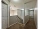 Second floor hallway with carpet, paint in neutral color, with access to bedrooms at 607 Kissimmee Ln, Kissimmee, FL 34759