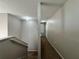 Hallway on second floor with carpet, paint in neutral color, and overhead lighting at 607 Kissimmee Ln, Kissimmee, FL 34759