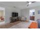 Bedroom featuring ceiling fan, neutral paint, wooden floors, with view of en suite bath at 7614 Lake Dr, Belle Isle, FL 32809