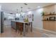 Eat-in kitchen featuring a large island with bar seating, and modern appliances at 7614 Lake Dr, Belle Isle, FL 32809