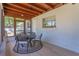 Enclosed porch featuring an outdoor dining area at 7614 Lake Dr, Belle Isle, FL 32809