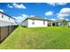 Spacious backyard with lush green lawn and privacy fence, perfect for outdoor enjoyment at 780 Livestock Loop, St Cloud, FL 34771