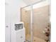 Walk-in shower with a glass door at 780 Livestock Loop, St Cloud, FL 34771