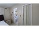 Bright bedroom with en-suite bathroom and closet near the bed at 7813 Arabian Pl, Orlando, FL 32818